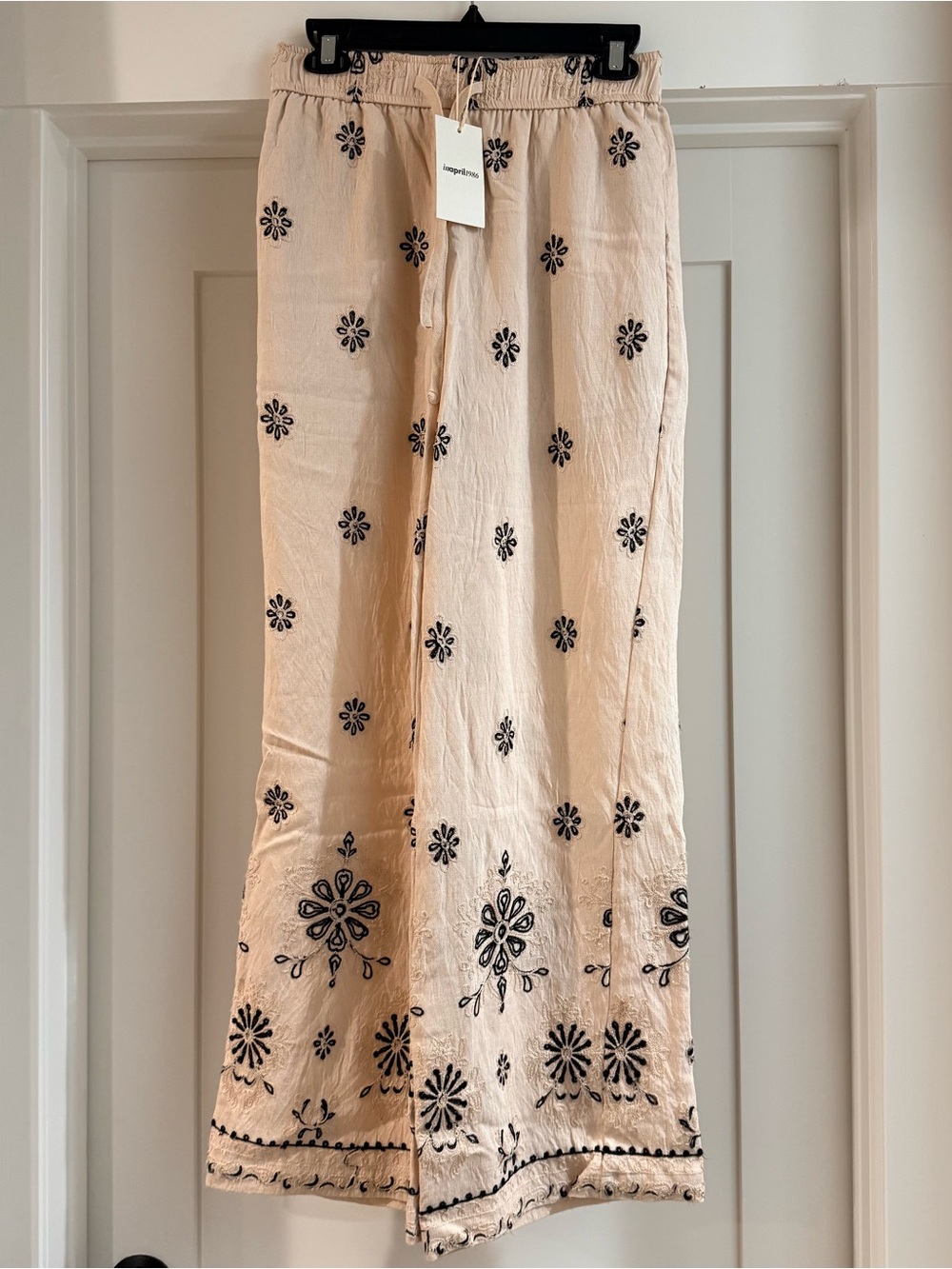Parisian Beige Pants with Black Floral Motif
